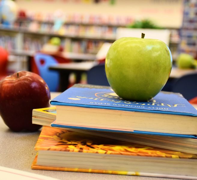  library book with apple on top